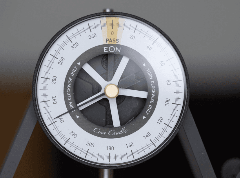 Eddy current pendulum dial close-up — reference for comparing simulator readings
